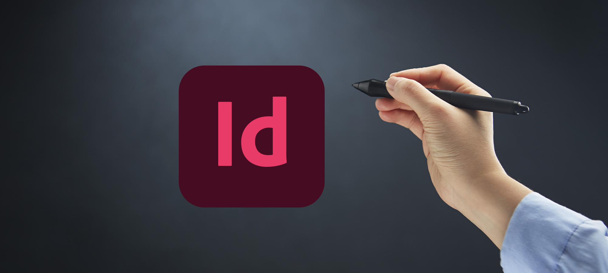 Logo Indesign avec une main qui tient un stylet